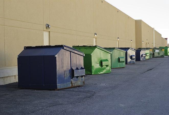 a row of industrial dumpsters at a construction site in Addison, IL